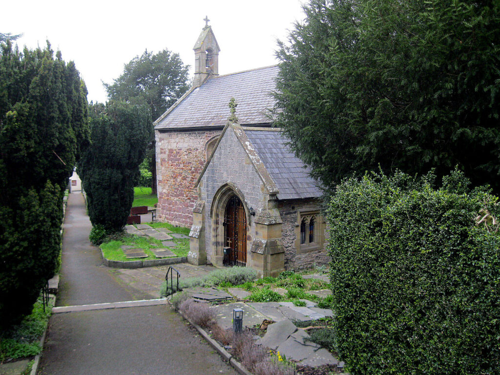 old building, path, trimmed shrubs